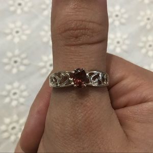 Silver-colored ring with pink stone